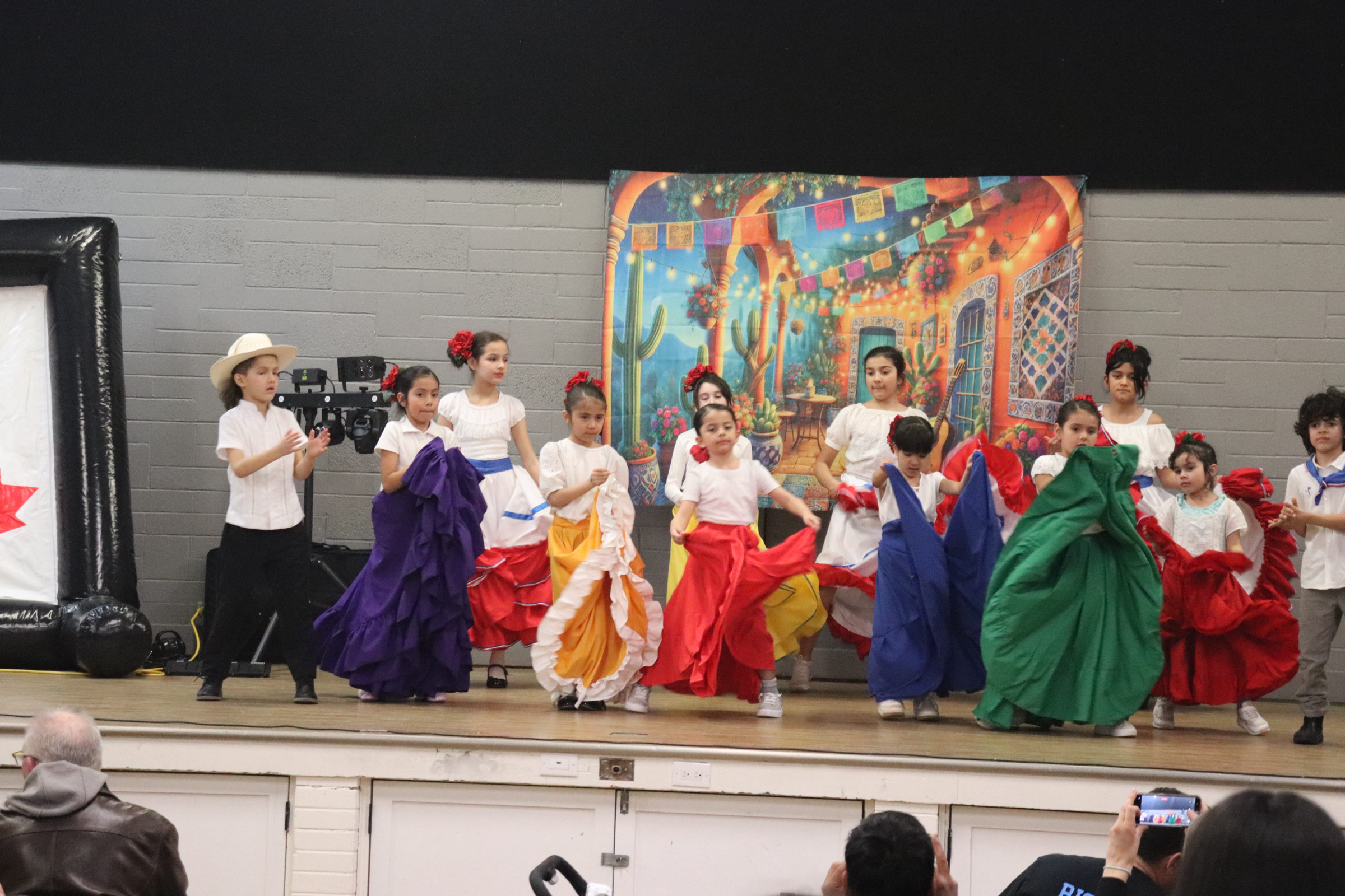 Latin community festival volunteers and families